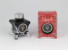 Load image into Gallery viewer, A glass bottle of 50ml Diamine Red Edition Inkvent Seize the Night fountain pen ink next to packaging box, in front of a white background.
