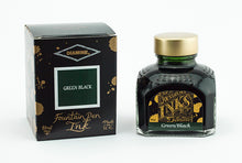 Load image into Gallery viewer, A glass bottle of 80ml Diamine Green Black fountain pen ink next to its packaging box, in front of a white background.
