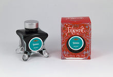 Load image into Gallery viewer, A glass bottle of 50ml Diamine Red Edition Inkvent Yuletide fountain pen ink next to packaging box, in front of a white background.
