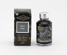 Load image into Gallery viewer, A glass bottle of 50ml Diamine Moon Dust shimmering fountain pen ink next to its packaging box, in front of a white background.
