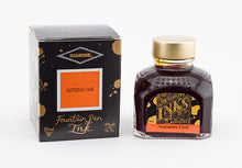 Load image into Gallery viewer, A glass bottle of 80ml Diamine Autumn Oak fountain pen ink next to its packaging box, in front of a white background.
