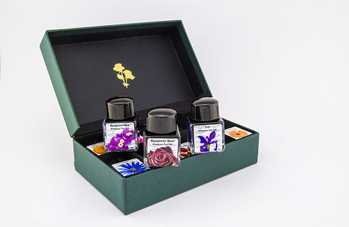 A gift set of 10 x glass bottle of 30ml Diamine fountain pen ink in assorted flower inspired colours.