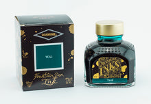 Load image into Gallery viewer, A glass bottle of 80ml Diamine Teal fountain pen ink next to its packaging box, in front of a white background.
