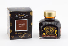 Load image into Gallery viewer, A glass bottle of 80ml Diamine Chocolate Brown fountain pen ink next to its packaging box, in front of a white background.

