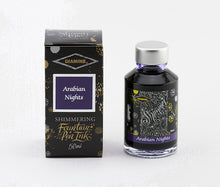 Load image into Gallery viewer, A glass bottle of 50ml Diamine Arabian Nights shimmering fountain pen ink next to its packaging box, in front of a white background.
