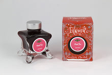 Load image into Gallery viewer, A glass bottle of 50ml Diamine Red Edition Inkvent Pink Ice Shimmer fountain pen ink next to packaging box, in front of a white background.
