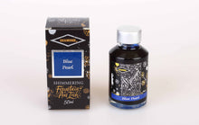 Load image into Gallery viewer, A glass bottle of 50ml Diamine Blue Pearl shimmering fountain pen ink next to its packaging box, in front of a white background.
