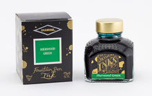 Load image into Gallery viewer, A glass bottle of 80ml Diamine Sherwood Green fountain pen ink next to its packaging box, in front of a white background.
