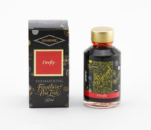 Load image into Gallery viewer, A glass bottle of 50ml Diamine Firefly shimmering fountain pen ink next to its packaging box, in front of a white background.
