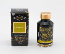Load image into Gallery viewer, A glass bottle of 50ml Diamine Razzmatazz shimmering fountain pen ink next to its packaging box, in front of a white background.
