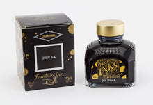 Load image into Gallery viewer, A bottle of 80ml Diamine Jet Black fountain pen ink next to its packaging box, in front of a white background.
