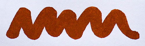 A colour swatch of Diamine Ochre fountain pen ink.