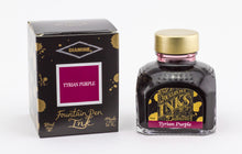 Load image into Gallery viewer, A glass bottle of 80ml Diamine Tyrian Purple fountain pen ink next to its packaging box, in front of a white background.
