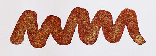 A colour swatch of Diamine Brandy Dazzle shimmering fountain pen ink.